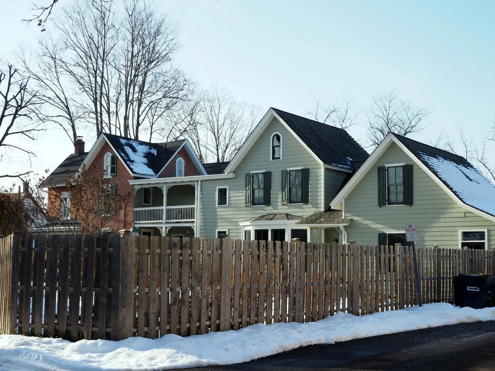 Charming snow-covered historic homes in Doylestown, Pennsylvania during winter.